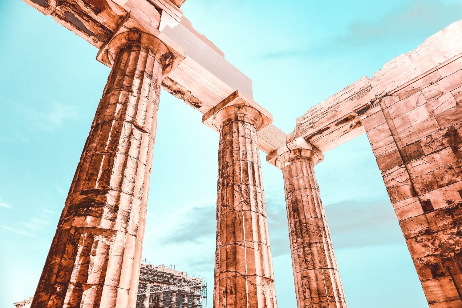 three brown concrete pillars