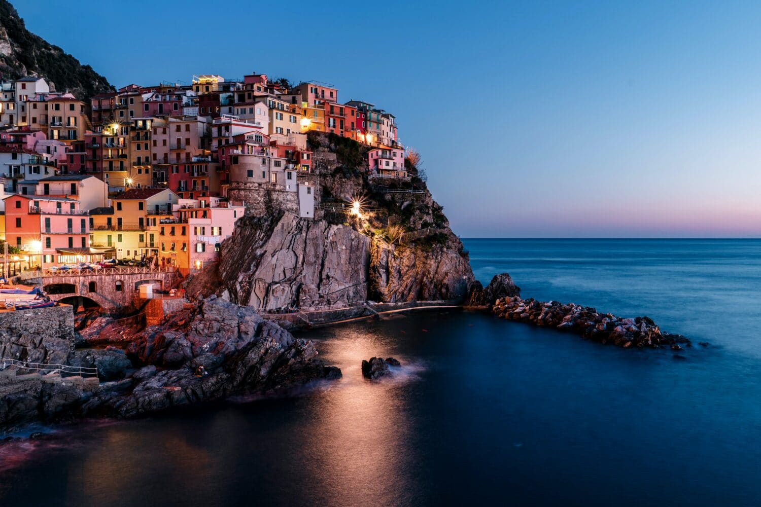 lighted houses near ocean